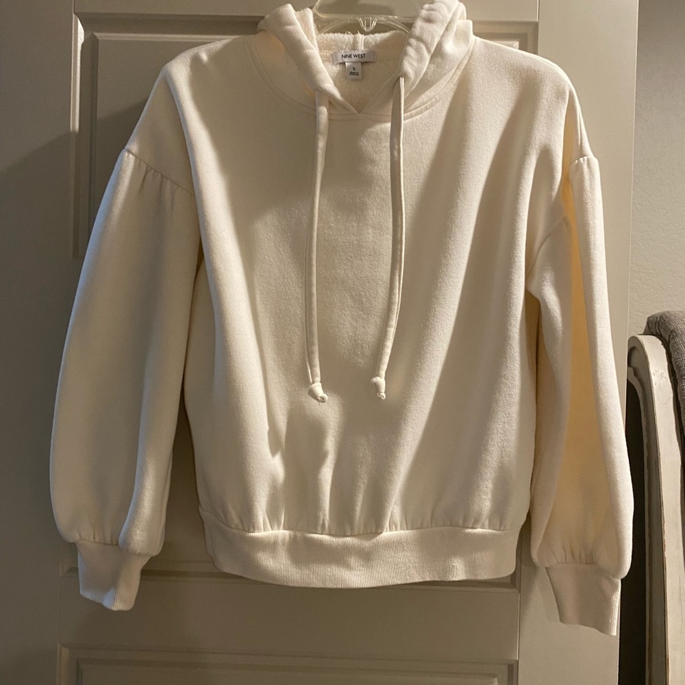 Cream colored ladies fancy lined hoodie.